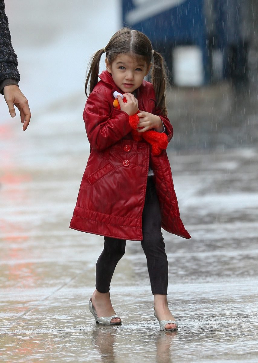 A D&G Coat
Looking ready to hail a cab, Suri Cruise braved a Boston rainstorm in a sleek D&G trench, black leggings and peep-toe silver heels. Phil Penman/SplashNewsOnline.com