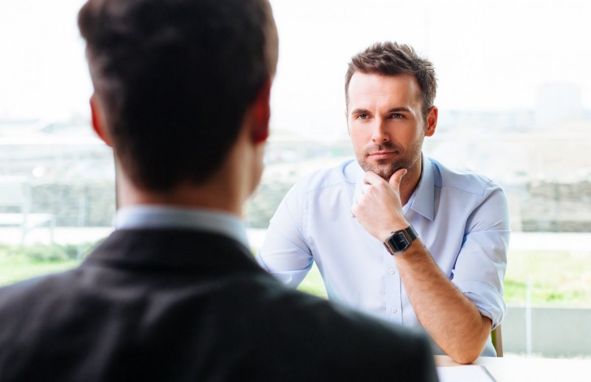 Listening Salesperson, Watch, Outerwear, Dress shirt, Human, Sleeve, Gesture