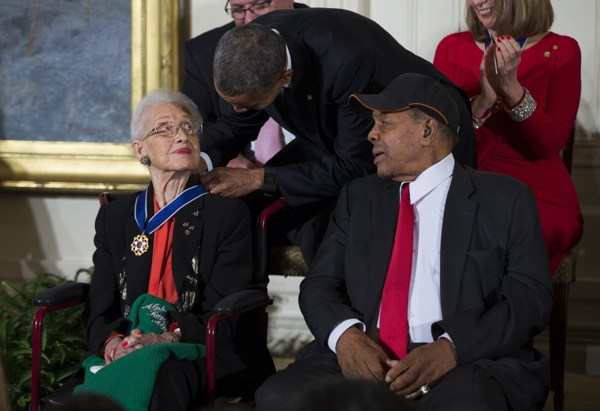 Willie Mays, right, watches as President Barack Obama presents the Presidential Medal of Freedom to NASA mathematician Katherine Johnson during a ceremony in the East Room of the White House, on Tuesday, Nov. 24, 2015, in Washington. Obama is recognizing 17 people with the nation’s highest civilian award, including one of the greatest catchers in baseball history and a 