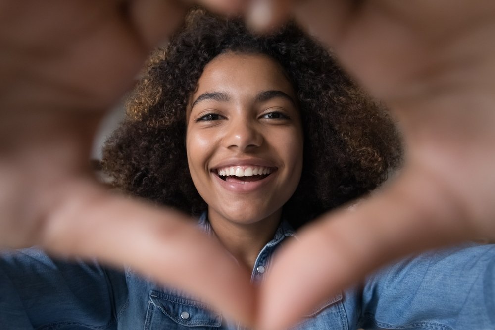 Beauty, Smile, Lip, Eyebrow, Jheri curl, Flash photography, Happy, Iris, Gesture