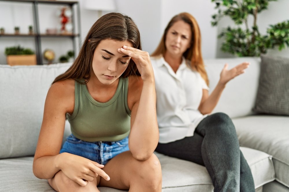 Mom And Daughter Arguing, Joint, Hairstyle, Shoulder, Leg, Couch, Muscle, Comfort, Neck, Fashion, Thigh